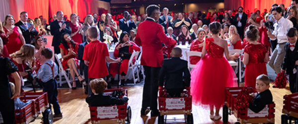 Riley Red event with kids in wagon on stage