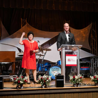 Liz Elkas and Gil Peri on stage at Riley Red event