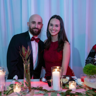 Couple posing for photo at Riley Red event