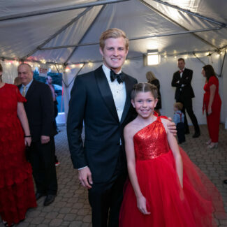 Marcus Ericsson with Riley kid at Riley Red event